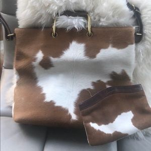 Cowhide tote with makeup up bag. Never used..